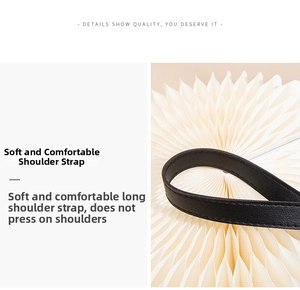 Detail of the soft black leather long shoulder strap on elegant white pleated prop