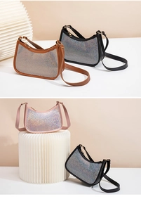 Three rhinestone hobo bags in black, caramel, and pink on white decorative columns