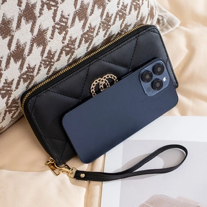 Black quilted long wallet for women with golden rings and detachable wrist strap