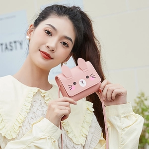 Cute pink rabbit-shaped mini crossbody bag for girls with 3D ears and cartoon face print