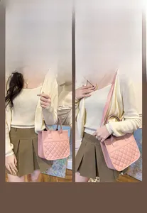 Detail view of pink quilted tote bag showing rhombus stitching and leather straps