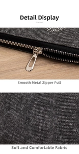 Detailed macro view of smooth silver metal zipper and soft washed charcoal denim fabric