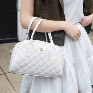 Elegant white quilted boston handbag with camellia logo and double handles for women