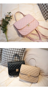 Detailed view of quilted faux leather handbags with gold swivel locks in three colors
