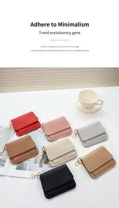 Mini lychee grain leather card holders in various colors with gold hardware charms