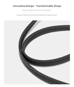 Détail de couture double renforcée sur bandoulière en cuir noir pour solidité et toucher doux