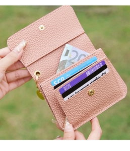 Inside view of pink pebble leather wallet showing card slots and bill compartment