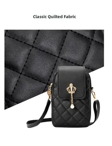 Macro view of classic quilted leather texture and a black pearl crossbody phone bag
