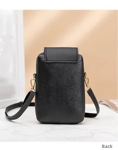 Back view of a black quilted mobile phone bag featuring adjustable leather shoulder strap