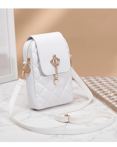 Detailed view of white quilted PU leather phone bag with gold crown and pearl pendant