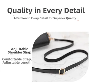Detail of black leather adjustable shoulder strap with premium gold metal buckle