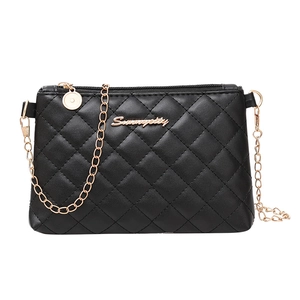 Classic black quilted crossbody bag with gold chain strap and elegant metallic logo