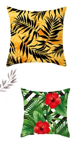Detailed view of tropical palm leaf and hibiscus flower print pillow covers in nordic style