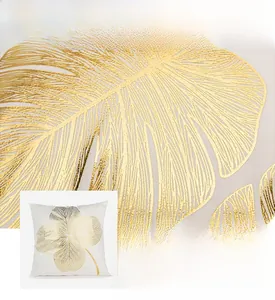 Detail shot of elegant golden leaf pattern on premium white decorative pillowcase fabric