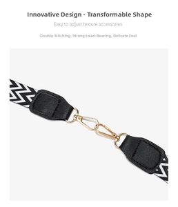 Macro view of adjustable chevron strap with black leather ends and golden metal clasps