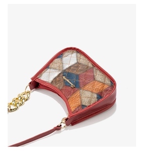 Top view of multicolor quilted underarm bag with gold chain and letter logo detail