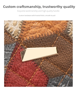 Detail of multi-color patchwork leather bag with textured finish and gold hardware