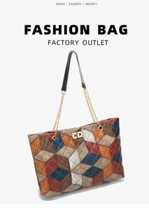 Detail of multi-color quilted tote bag featuring a gold twist lock and chain strap