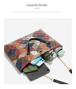Spacious interior of a color-block bucket bag showing tablet, umbrella and makeup