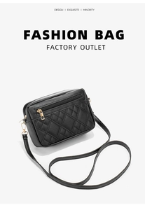 Close-up of black quilted PU leather shoulder bag featuring gold zipper and metal hardware