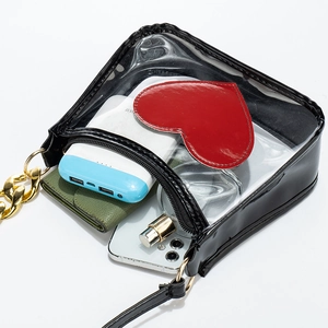 Black PVC transparent crossbody bag with red heart patch and golden chain strap