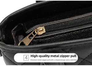 Dettaglio della tasca interna con cerniera e hardware dorato su borsa a secchiello nera