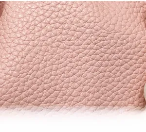 Close-up of pink lychee pattern faux leather texture on this stylish bucket bag