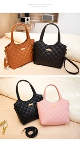 Close-up of quilted rhombic pattern on PU leather tote bag with gold metal hardware