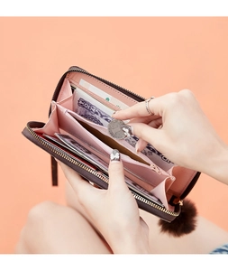 Detailed interior view of long faux leather wallet featuring card slots and coin pocket
