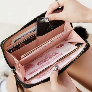 Women long quilted wallet with pink interior and credit card slots for organization