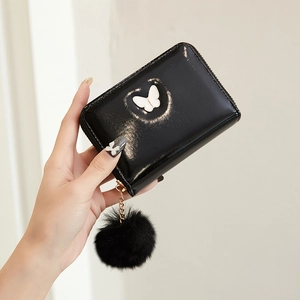 Mini black patent leather wallet with white butterfly and plush ball keychain