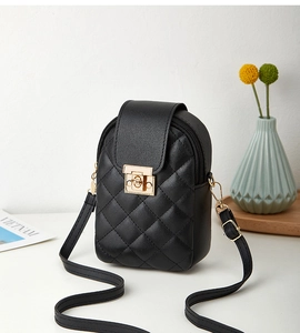 Detail of black quilted mobile phone bag featuring a gold clasp and premium PU leather texture