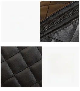 Dettaglio macro della pelle nera trapuntata con cuciture di alta qualità e cerniera in metallo