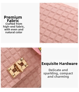 Detail of pink plaid embossed leather bag with gold rivet lock and floral silk scarf