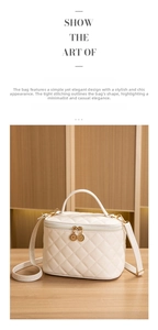 Detail of white quilted makeup bag with double metal zippers and golden chain buckles