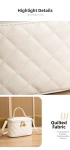 Macro shot of quilted cream faux leather fabric with gold zipper and handle detail