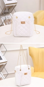 Detail of white quilted crossbody bag with golden chain and metallic twist lock