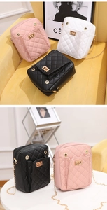 Detail of quilted leather phone bags in pink, white, and black with golden metal turn-locks