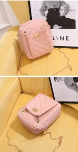 Detail of pink quilted leather crossbody bag featuring gold chain and square buckle flip