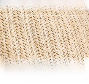 Detailed macro view of high-quality woven straw fabric texture on a small square bag