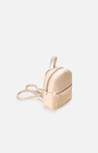 Detail of beige woven mini backpack with wave texture and premium gold hardware