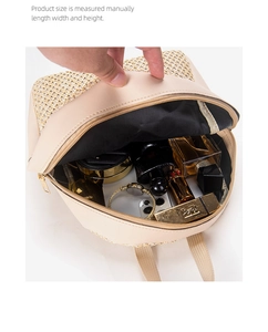 Macro view of woven backpack interior showcasing spacious storage for cosmetics and phone