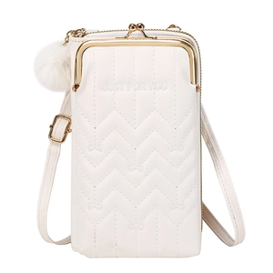 Close-up of white quilted crossbody phone bag with gold metal frame and plush pompom charm