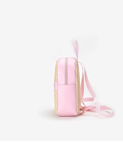 Side view of mini pink leather backpack with woven texture and metallic zippers