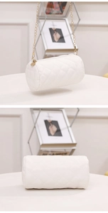 Detailed close-up of white quilted cylindrical chain bag with classic rhombus pattern