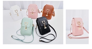 Detail view of woven leather mini phone bags in five colors with pearl cat ear pendants