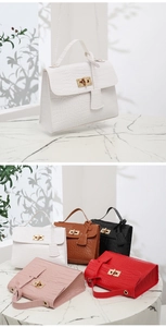 Detailed macro view of crocodile pattern textures and various colors of crossbody handbags
