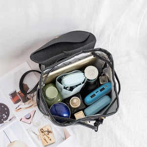 Quilted black drawstring backpack with marble lining showing large storage capacity