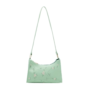 Chic mint green embroidered shoulder bag with floral patterns on smooth leather material