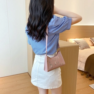 Elegant pink floral embroidered faux leather underarm bag for women in a hobo style